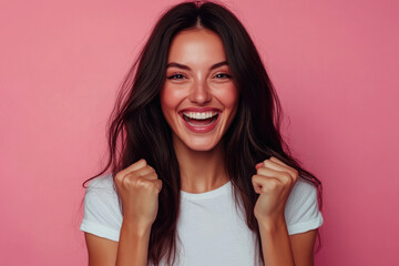 Fototapeta premium Young woman waving fists to celebrate victory