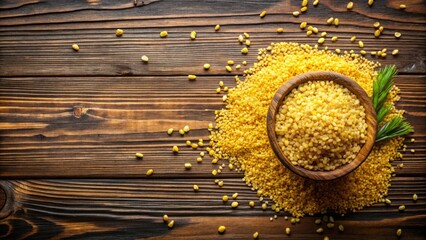 Obraz premium Top View Flat Lay of Bulgur Durum Wheat on Rustic Wood Table for Food Background, Healthy Grain, Organic Ingredients, Culinary Inspiration, Natural Textures, Rustic Decor