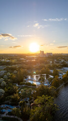 Golden hour in Orlando captures the vibrant sunset over the cityscape, casting warm hues across the...