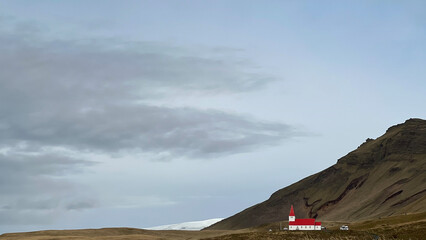 Church near Vík, Iceland, with mountains and glacier