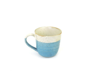 Empty two-tone beige-blue mug with dotted isolated on white background. Use for home or restaurant, food design. Concept kitchen utensils and tableware. Side view.