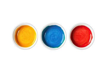 Three vibrant watercolor paint cups in primary colors