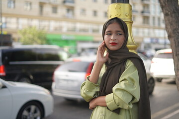 Fototapeta premium muslim woman walking on the street