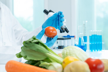 Scientist check chemical fruit residues in laboratory. Control experts inspect the concentration of...