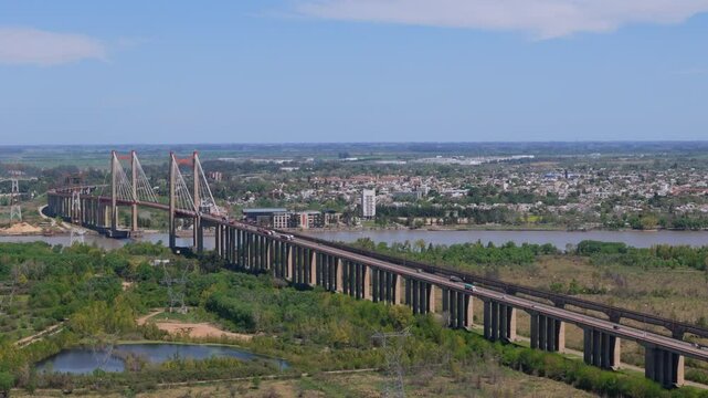 Aerial view of suspension bridge Z&aacute;rate Brazo Largo over Paran&aacute; River with city in background, Argentina