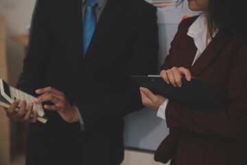 Audit concept,Administrator business man financial inspector and secretary making report calculating balance. Internal Revenue Service checking document.