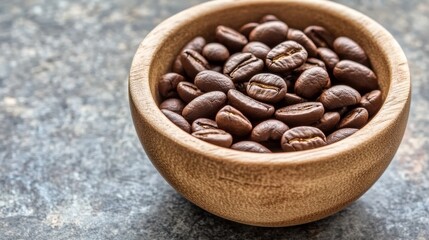 Fototapeta premium A wooden bowl filled with roasted coffee beans, showcasing rich textures and colors.