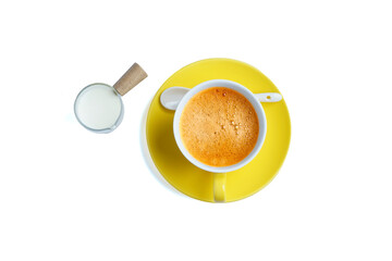 Yellow coffee cup with fresh milk on a white background