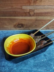 Satay with tomato sauce is a type of street food