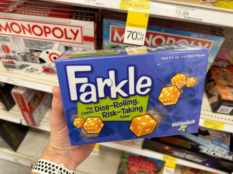 Holding new Farkle dice game.