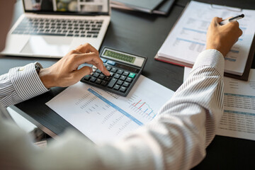 Auditor or internal revenue service staff, Business men checking annual financial statements of...