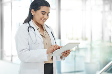 Girl, doctor and typing with tablet in hospital for healthcare schedule, planning surgery and Telehealth. Woman, digital and medical research for health results, treatment feedback and history report