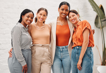 Happy, portrait and team of businesswomen hug in office with diversity, collaboration or friendship. Smile, solidarity and group of female editors with creative career at copywriting magazine agency.