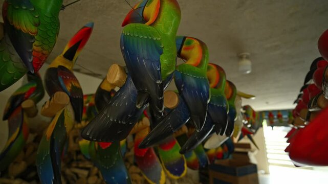Colorful balsa wood parrots. Close-up