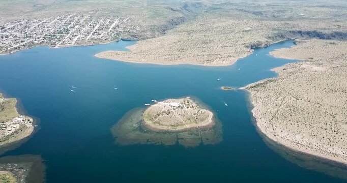 Panoramic shot of the new town of San Jos&eacute; de Gracia, Aguascalientes, Mexico, flying over the Presidente Calles Dam, which is part of the "Pueblo M&aacute;gico" program