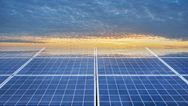 time lapse of the solar photovoltaic panels in the sunset glow
