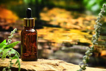 aromatherapy bottle with oil for homeopathic medicine or herbal medicine. Massage Oils. Natural cosmetics, skin care product in brown glass bottle on wood. Bottle with floral essential oil, close up 