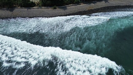 Summer seascape beautiful waves, blue sea water in sunny day. Top view from drone. Sea aerial surf, amazing tropical nature background. Mediterranean