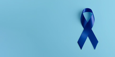 Blue awareness ribbon isolated on blue background. World diabetes day, 14 november, prostate cancer awareness banner. Blue November, International Men's Day concept with copy space