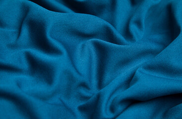 Blue fabric background. Selective focus.