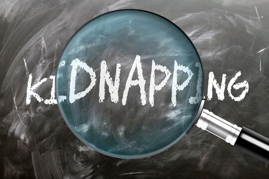 Kidnapping - learn, study and inspect it. Taking a closer look at kidnapping. A magnifying glass enlarging word 'kidnapping' written on a blackboard ,3d illustration
