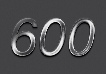 Chrome metal 3D number design of 600 on grey background.