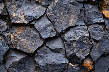 close up of dark grey cracked rock texture background  for design and architecture