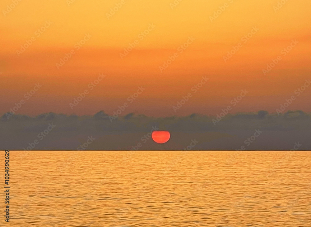 Wall mural sun, sea and colorful sky. atmosphere cloudscape panoramic romantic outdoors scenery background