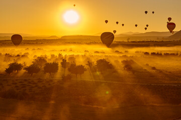 Balloons at dusk in Cappadocia. Famous flight in Goreme. Turkey