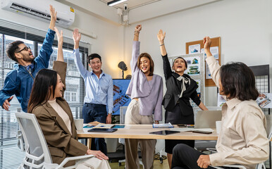 Happy business people putting their hands on top of each other and clapping. Business team making a stack of hands showing unity, corporate victory professional triumph good teamwork