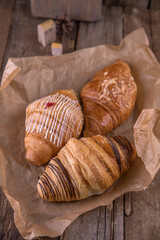 Croissants with different fillings on kraft paper