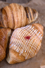 Croissants with different fillings on kraft paper