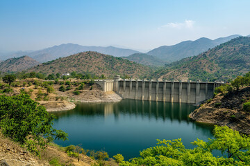 Fototapeta premium Robust Earth Dam Sustaining Large Lake and Supporting Biodiversity 