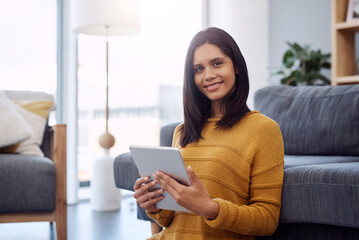 Home, portrait and woman with tablet by sofa for network, registration and information on email. Happy, relax and person with tech in living room for online shopping, website and ecommerce platform