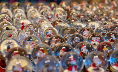 Lots of snow globes are sold at the Christmas market. Selective focus