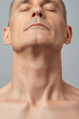 Obraz premium Calm expression of a man, neutral background