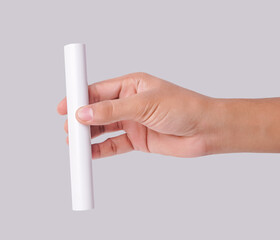 Closeup Photo Of A Male Hand Holding A New White PVC Plastic Pipe Isolated On White Background