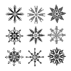 Set of hand drawn snowflakes. Black and white snowflakes painted with dry brush isolated on white background. Christmas and New Year symbol