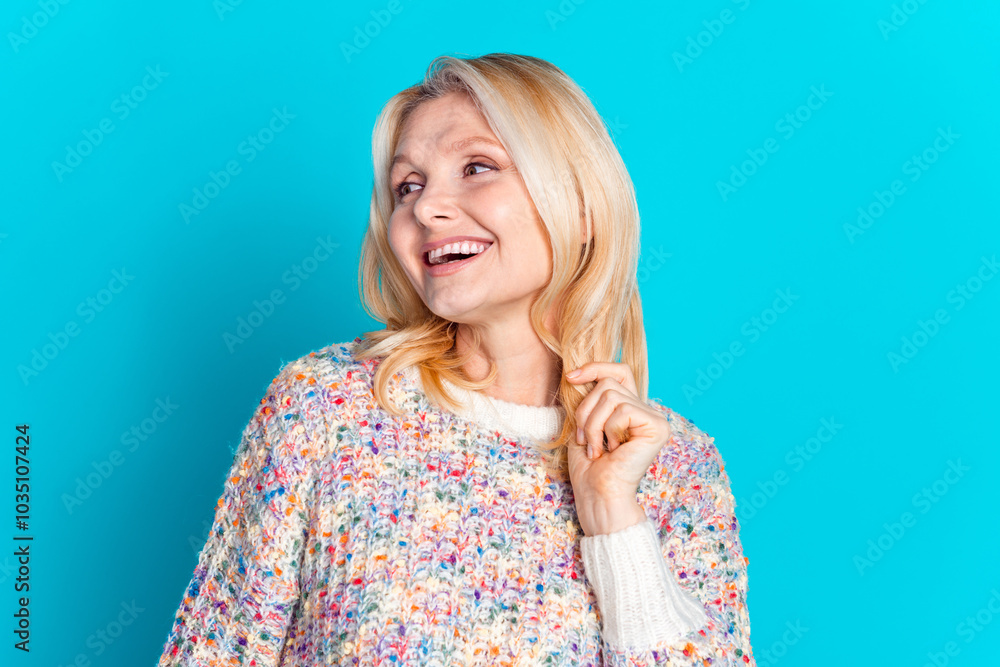 Wall mural Photo of nice aged woman look empty space wear pullover isolated on teal color background