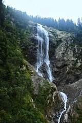 Austrian Alps - view of the Mischbach Waterfall near village Gasteig in Stubai Alps