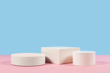 Blue and pink background for product presentation. Empty podiums. Mockup