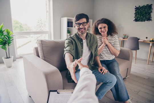 First person view photo of appointment psychotherapist handshake young marriage spouses visit home office indoors
