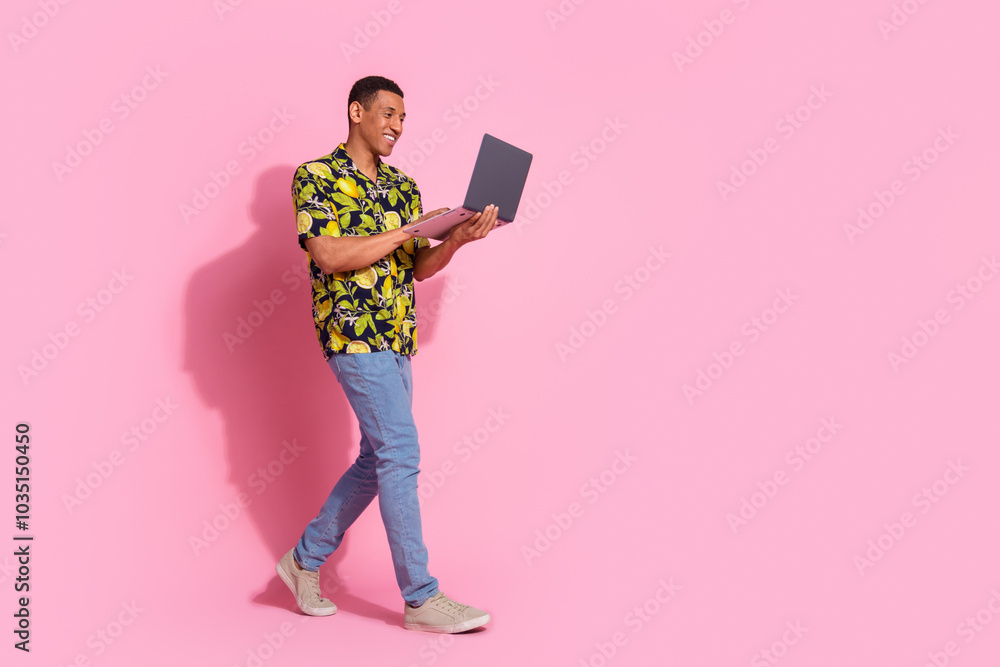 Canvas Prints Full size photo of pretty young male walking hold netbook wear trendy tropical print outfit isolated on pink color background