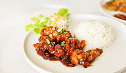 Crispy, sticky Korean fried chicken served with rice and creamy Asian slaw and paired. Korean fried chicken crispy crunchy with rice. Yangnyeom chicken.