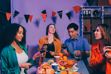 Joyful office Halloween party with coworkers in costumes, celebrating with drinks and laughter, fostering teamwork and festive spirit