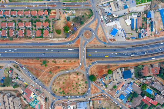 Aerial view of busy Thika Road with winding intersections and modern buildings, Kasarani, Nairobi, Kenya.