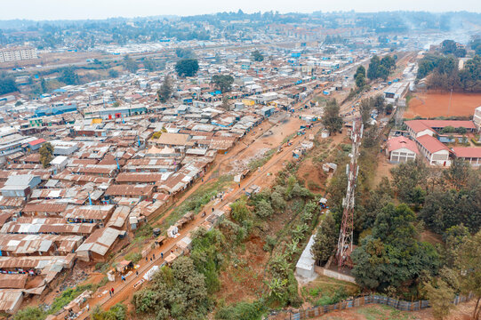 Aerial view of the sprawling residential community of Kibera slum with densely packed buildings and roads, Sarangombe, Nairobi, Kenya.