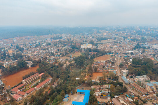 Aerial view of dense residential buildings and roads in Kibera slum, Nairobi, Kenya.