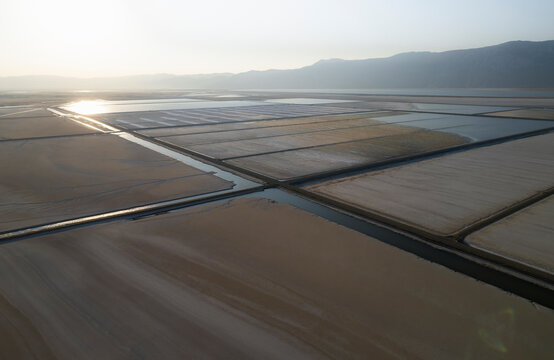 Aerial view of colorful salt farm with beautiful patterns and textures in wetland, Dazkiri, Turkey.