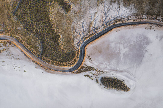 Aerial view of a beautiful salt farm with winding roads and unique patterns, Dazkiri, Turkey.